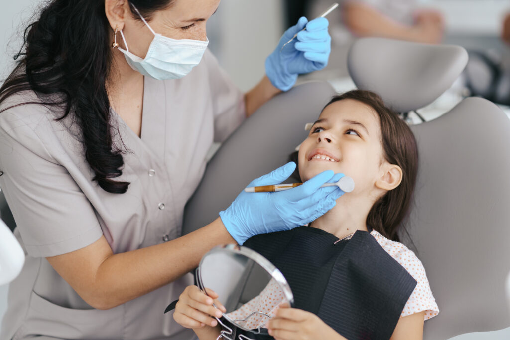 Child with special needs receiving calm and supportive dental care in a pediatric dental clinic