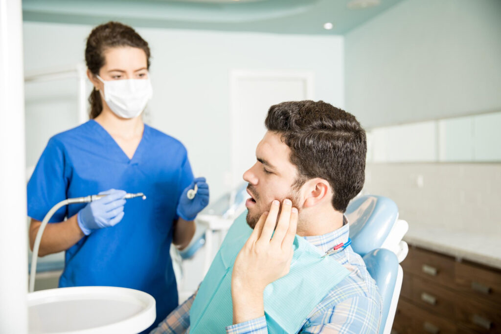 Dentist providing emergency dental care to a patient in Ottawa